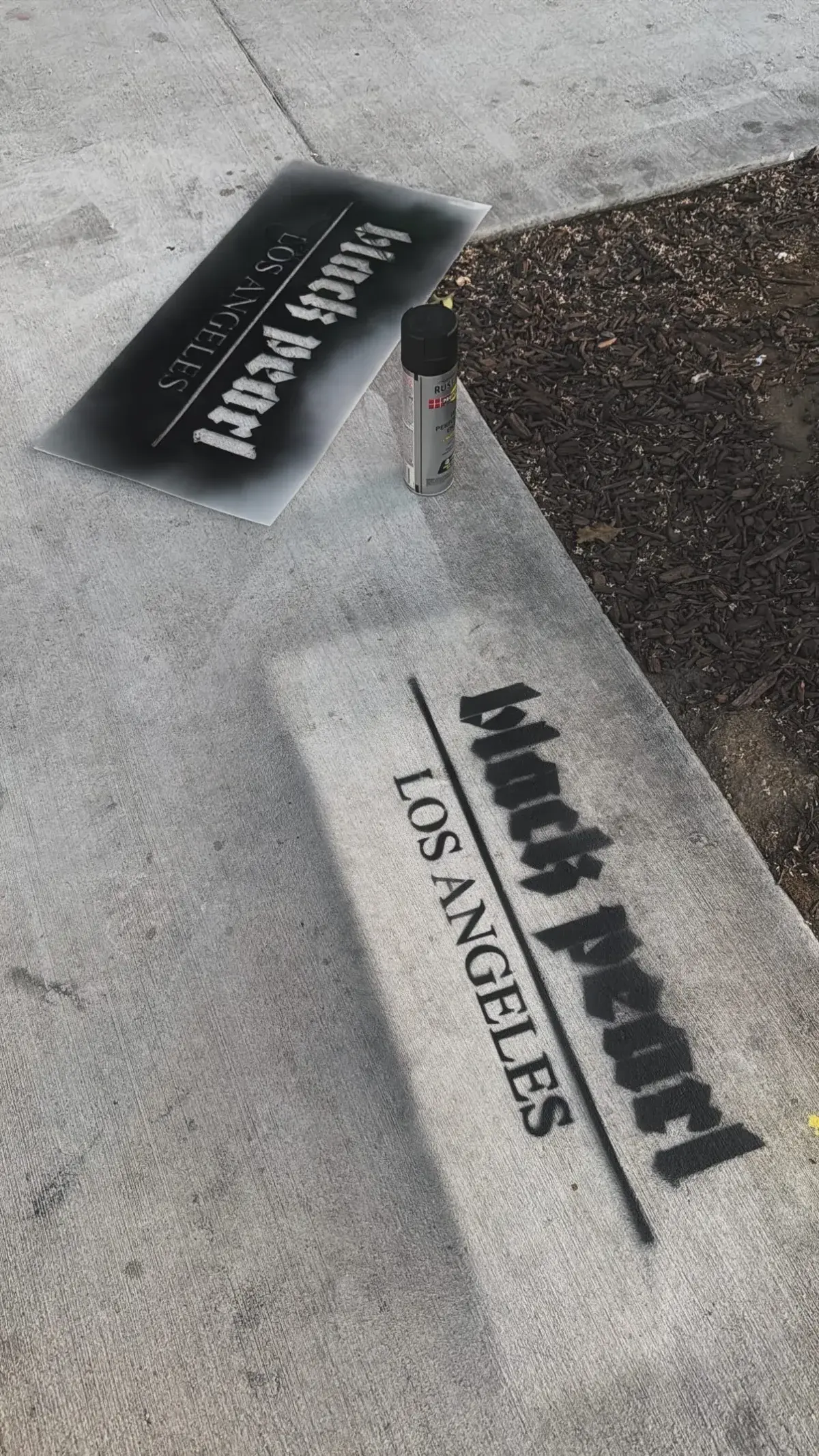 Black Pearl Los Angeles chalk spray stencil marketing on sidewalk with custom stencil template