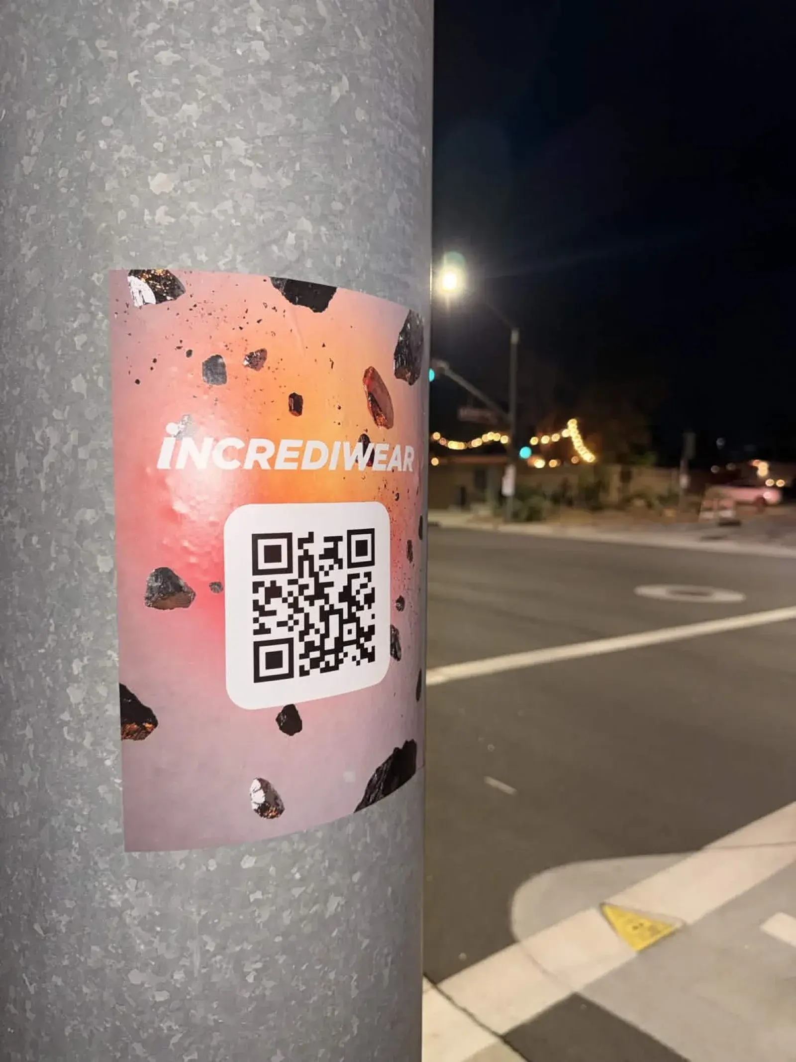 Incrediwear pole wrap guerrilla advertising at night